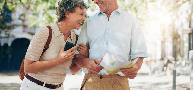 Retired couple walking around the town